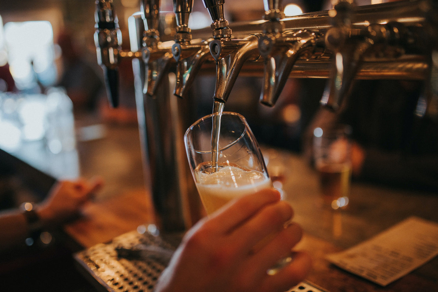 Craft beer being poured fresh from the tap.