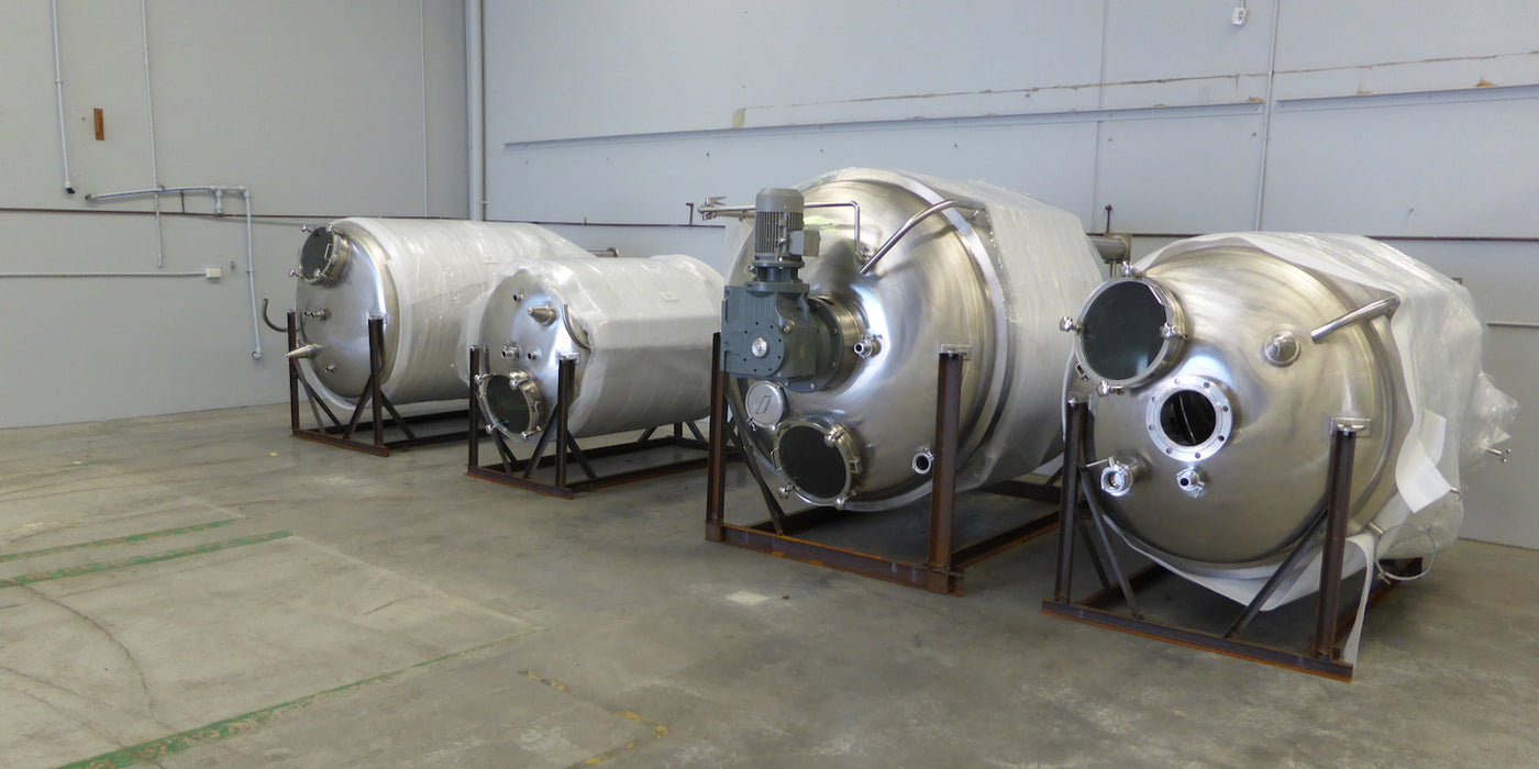 Four packages micro-brewery tanks in brewhouse