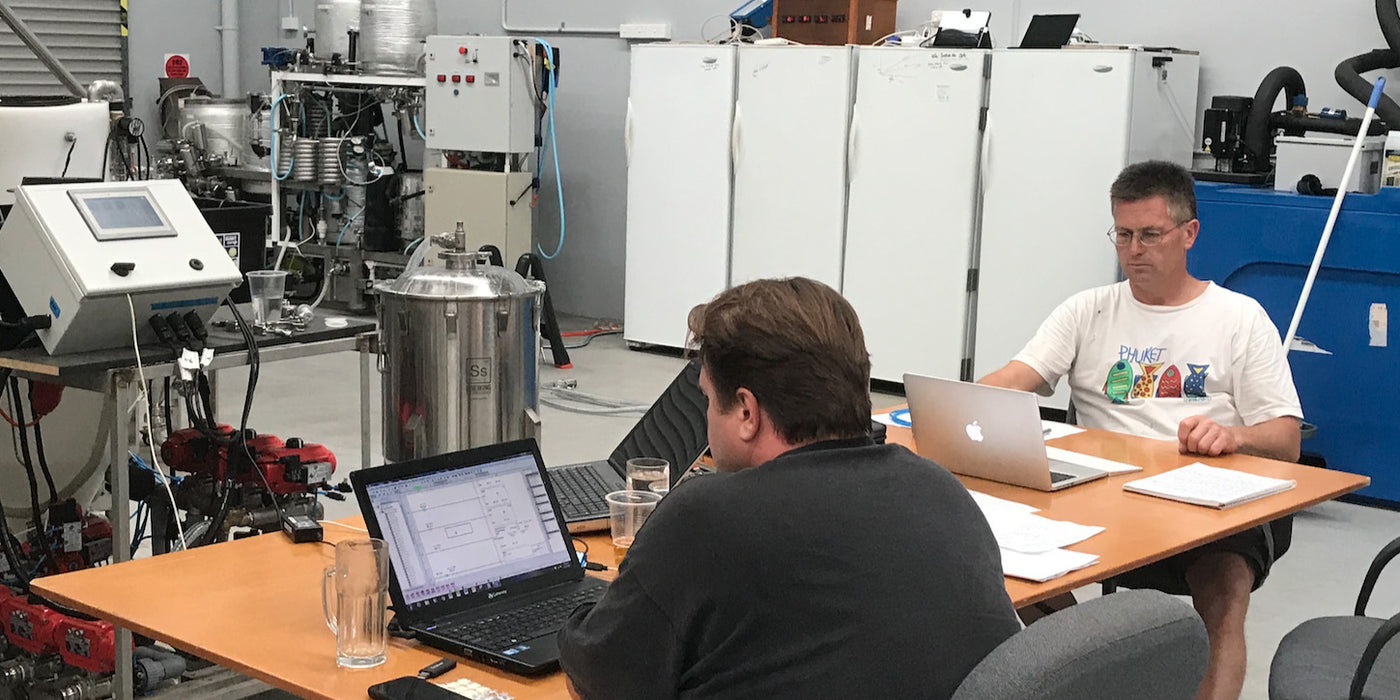 Geoff and Sven commissioning software for brewery build