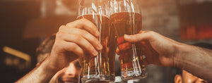 Ice cold Australian craft beer in a glasses cheersing.