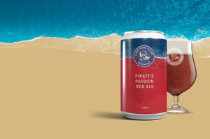 Limestone Coast Brewing pirates passion red ale can in front of craft beer glass of beer with the ocean in the background..