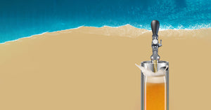 Keg with craft beer pouring out the tap.
