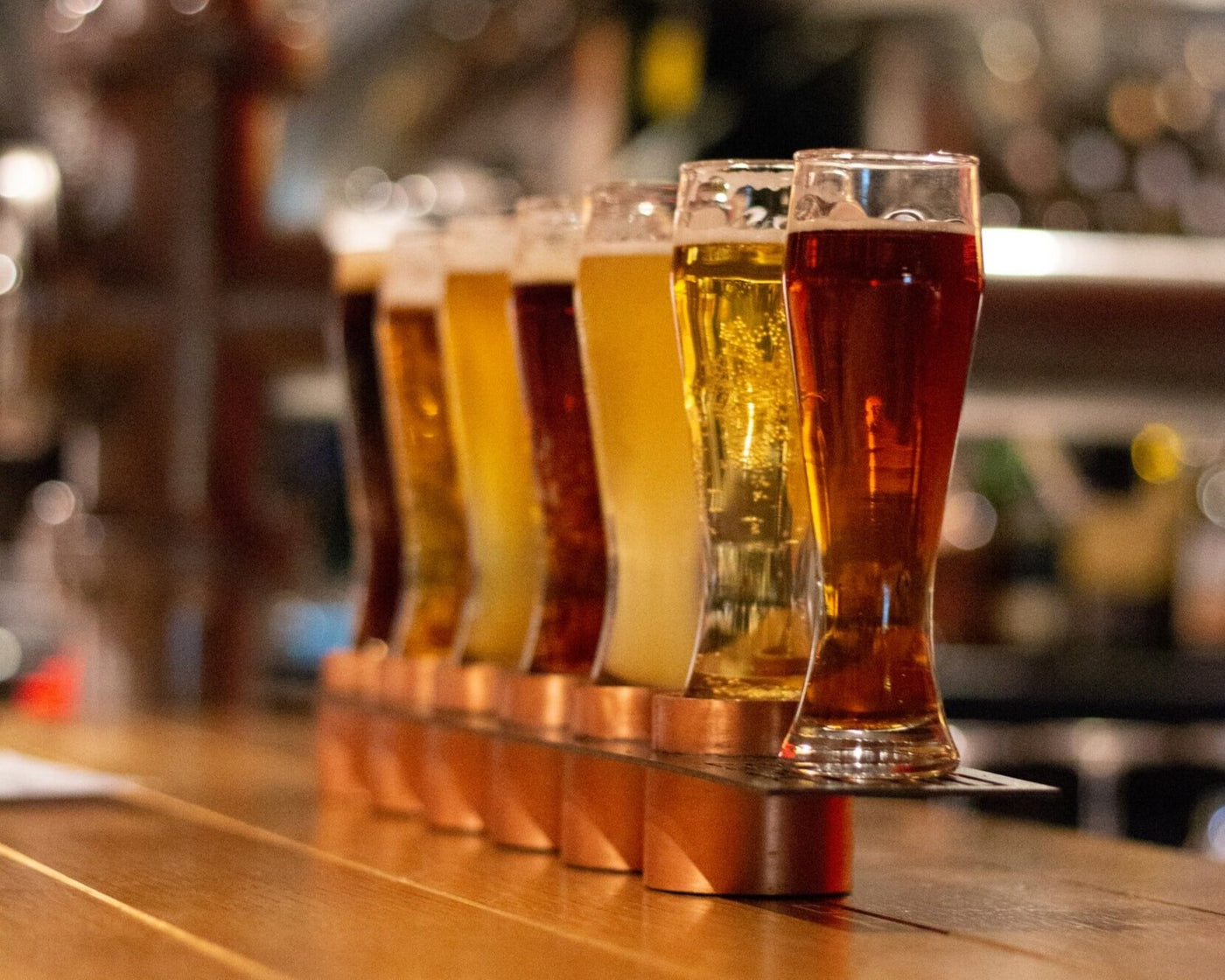 Craft beer glassed from the tap room ready to be served.